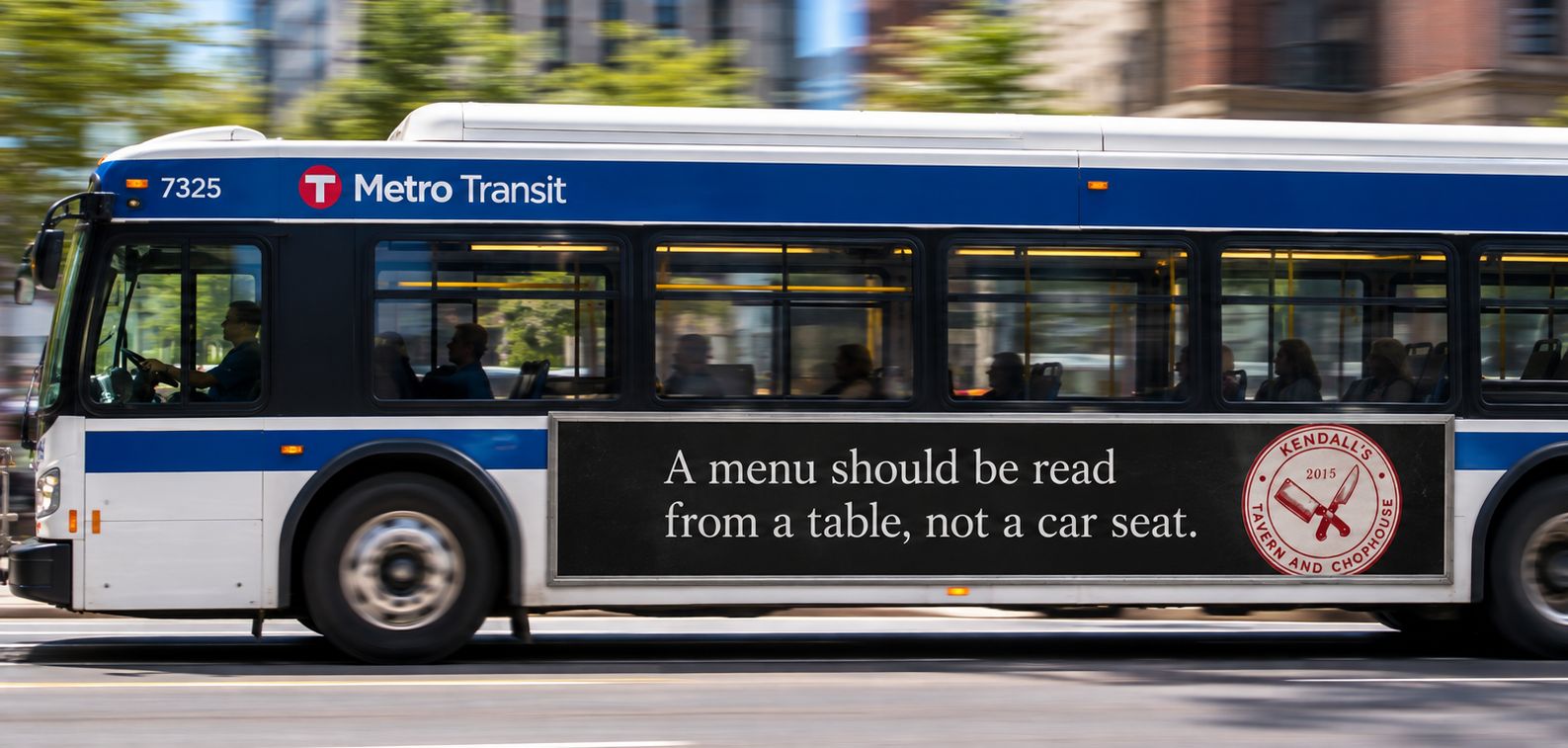 A Kendall’s ad on a Metro Transit bus: A menu should be read from a table, not a car seat.