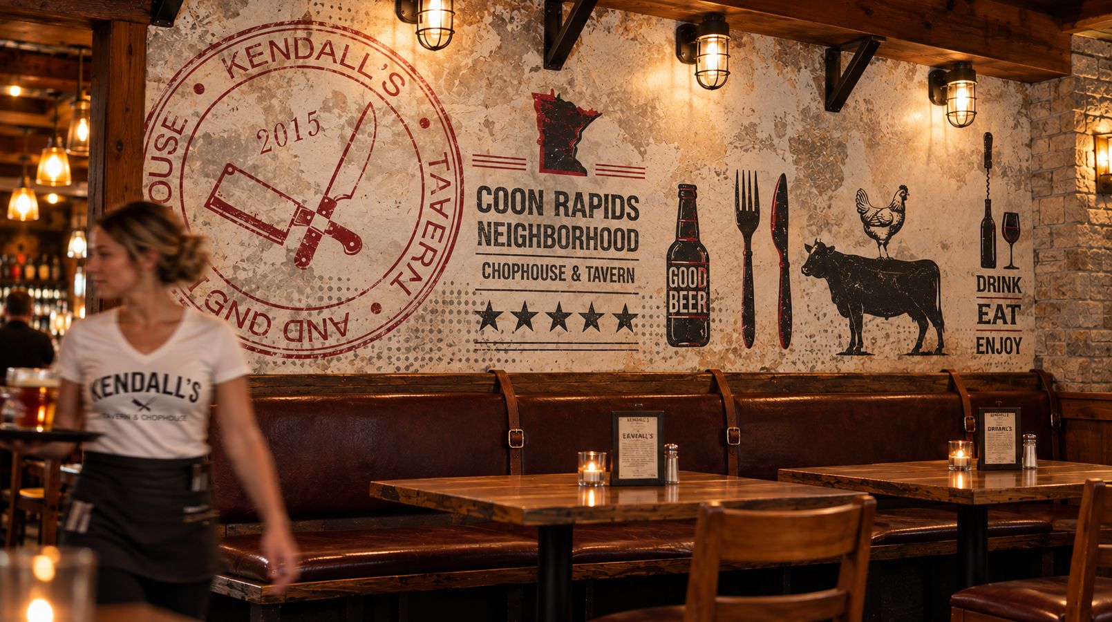 The Kendall’s dining room with its wall graphics, and a server in a Kendall’s shirt