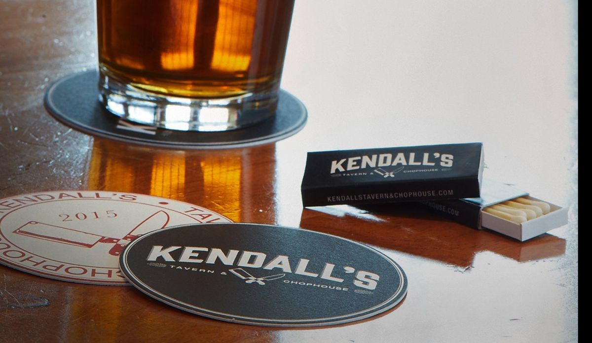A glass on a Kendall’s coaster