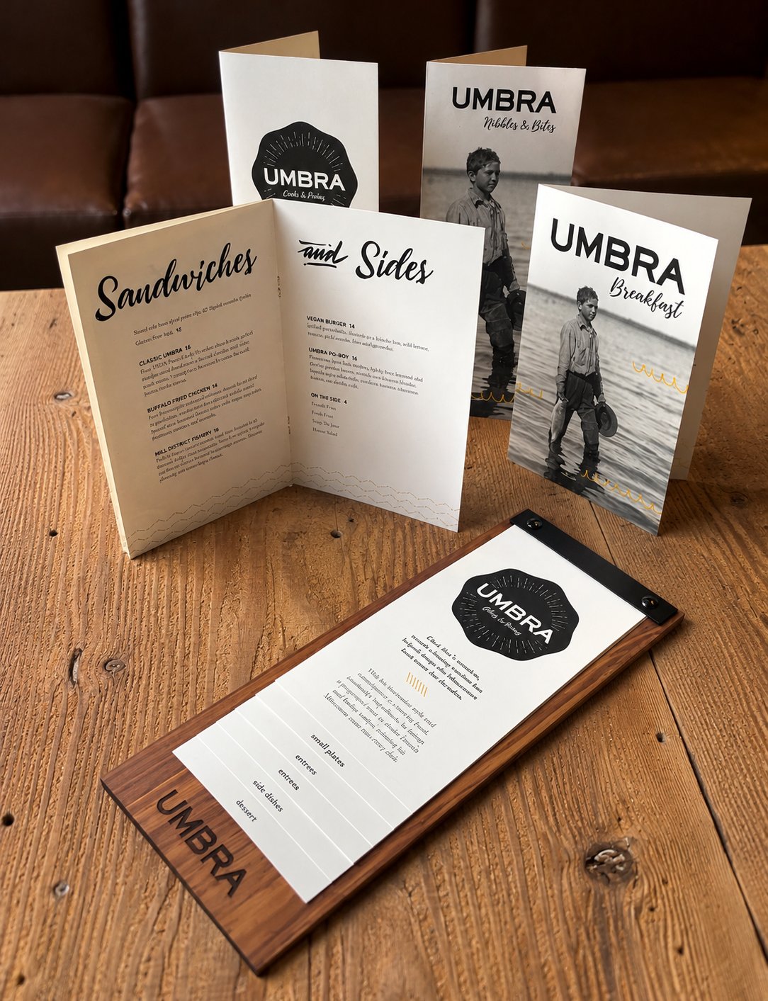 Umbra menus, including one on a wood menu board
